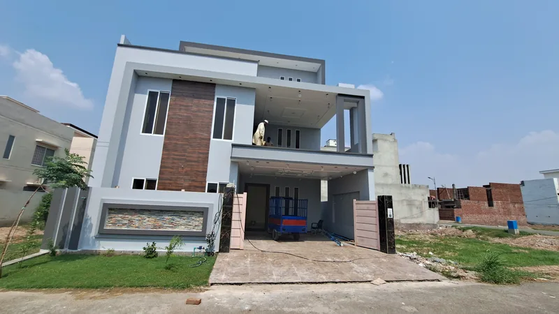 House 113 Dream Garden Multan front elevation wide view modern two storey house built by The Niaz Builders 2022-23